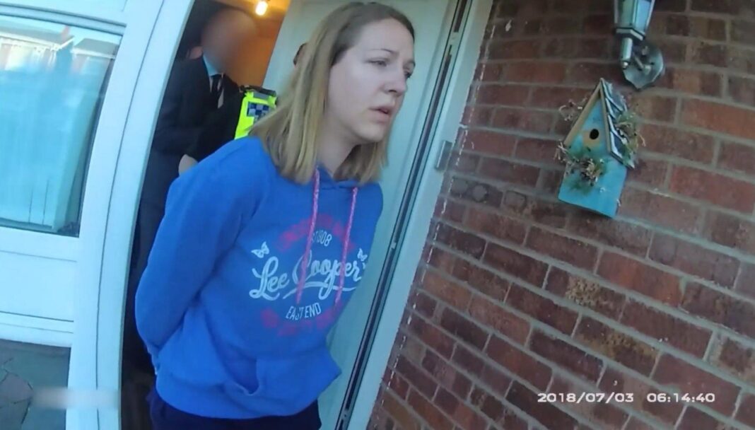 Lucy Letby: Families’ solicitor blames hospital bosses for police delay Image shows Lucy Letby, wearing a blue hooded top, being led in handcuffs from her house, in footage captured on a police body camera.