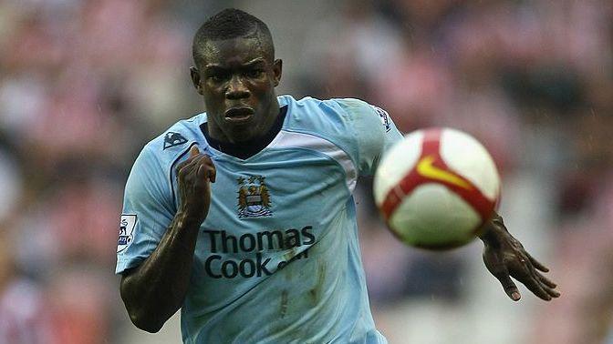 Micah Richards chases the ball while playing for Manchester City