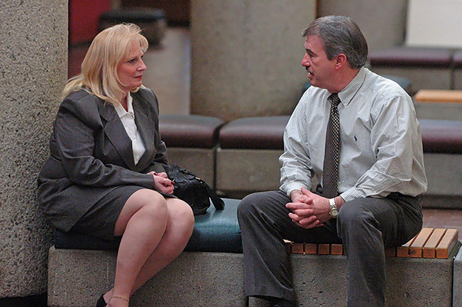 May Martinez sits with retired Knoxville Police department detective Randy York outside of a Knox County Court Room for a post conviction relief hearing for the killer of Martinez daughter Colleen Slemmer. February 27, 2006