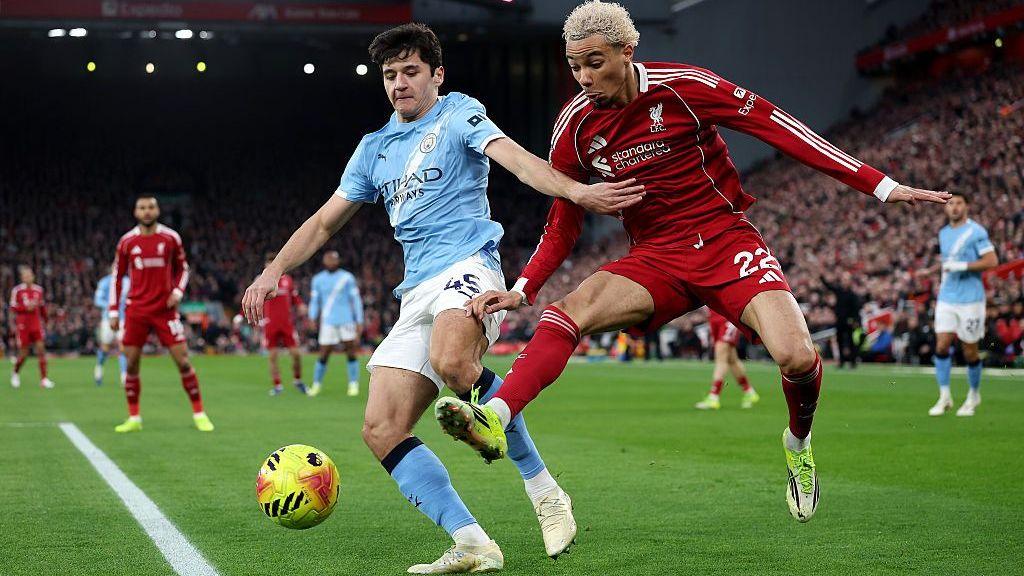 Manchester City's Abdukodir Khusanov challenges Liverpool's Hugo Ekitike