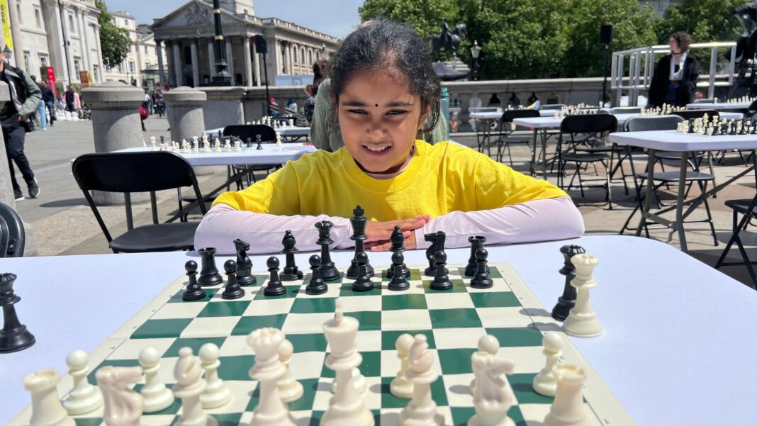 British chess prodigy, 11, becomes youngest woman grandmaster Bodhana Sivanandan poses with a chess board in front of her