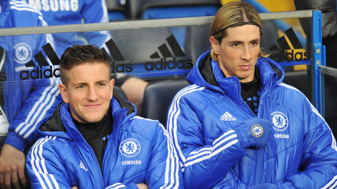 Chelsea players Sam Hutchinson (left) and Fernando Torres on the bench before the Premier League game with Aston Villa at Stamford Bridge on 31 December 2011