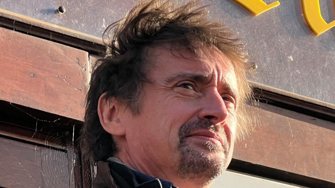 Top Gear star Richard Hammond thanks emergency crews 20 years on from crash Richard Hammond, a middle-aged man with brown hair blowing in the wind and a brown beard stares into the middle distance off camera.