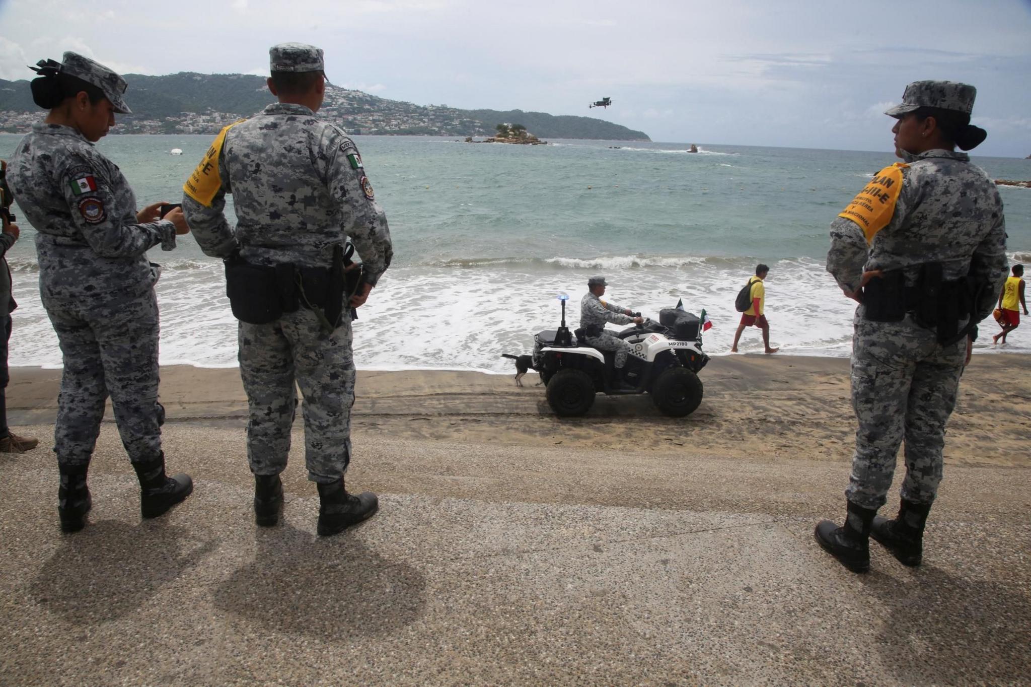 Members of the National Guard, one of them driving an ATV, patrol a beach as part of the Army, Air Force and National Guard's DN-III disaster relief plan as Category 5 Hurricane Polo strengthens off Mexico's Pacific coast, bringing heavy rain and flooding risks despite a forecast track away from shore, in Acapulco, Mexico, September 22, 2026.