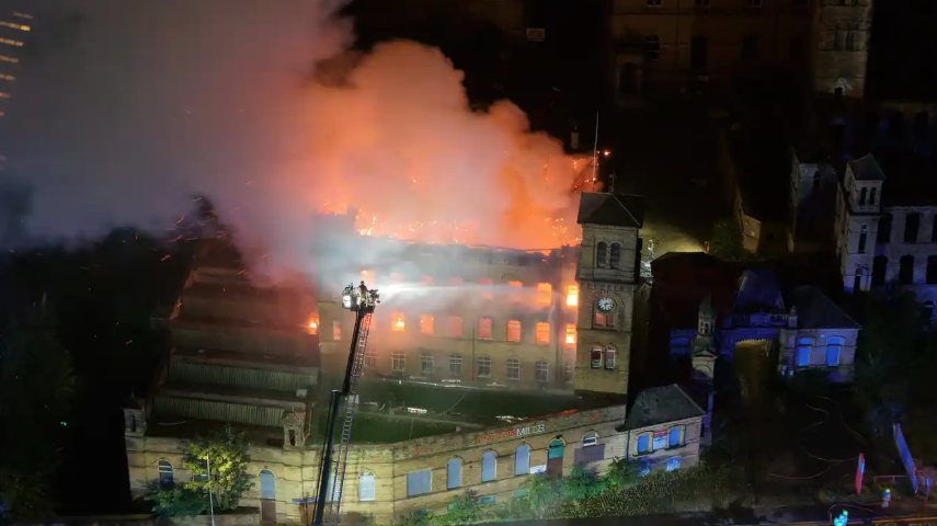 An old mill on fire