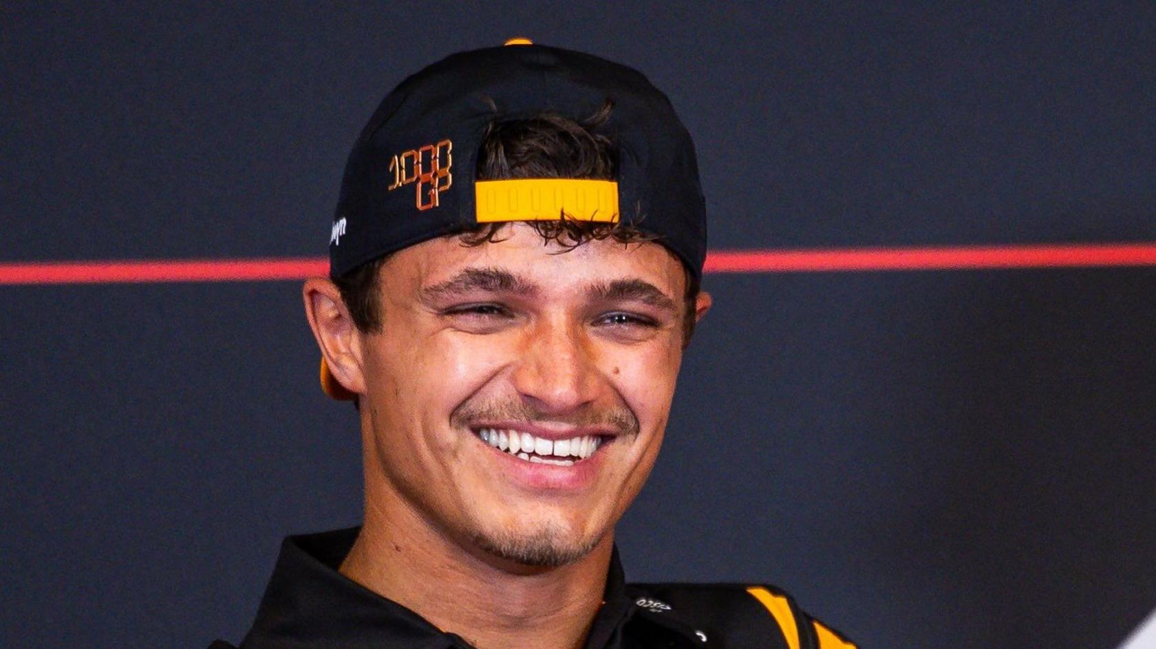 Lando Norris smiling during a Formula 1 news conference