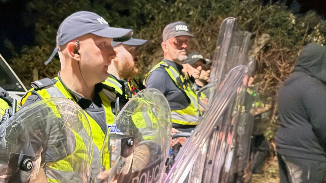 Man jailed for throwing bottle at migrant protest Police officers at the scene near Eastney Marina, Portsmouth.