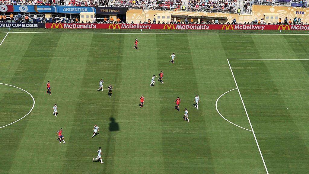 An aerial view of the 2026 Fifa World Cup final between Spain and Argentina at MetLife Stadium in New Jersey, USA, with McDonald's advertisements visible on electronic hoardings