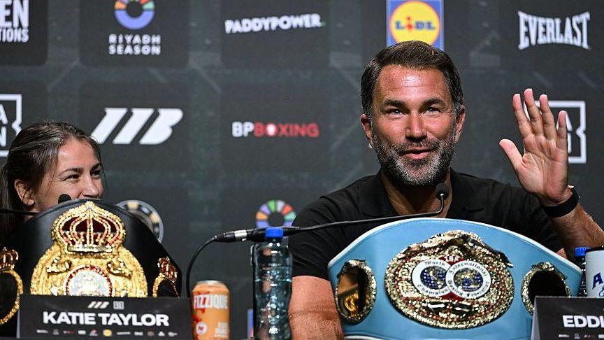 Eddie Hearn speaks as Katie Taylor looks on
