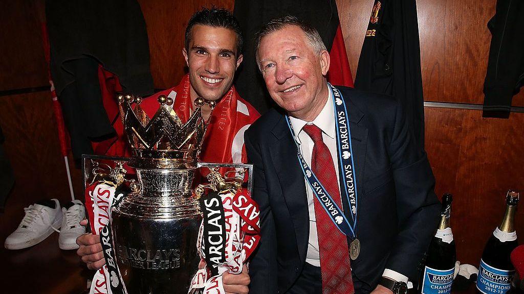 Robin van Persie and Sir Alex Ferguson pose with the Premier League trophy