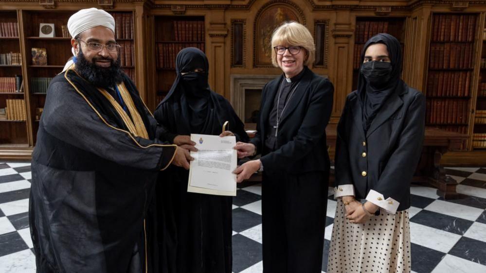 Handout photo sued by Lambeth Palace of Hafiz Muhammad Tahir Mehmood Ashrafi and his wife being presented with The Hubert Walter Award for Reconciliation and Interfaith Cooperation by The Most Revd and Rt Hon Dame Sarah Mullally, Archbishop of Canterbury for his outstanding work as an ambassador of interfaith harmony in Pakistan at The Lambeth Awards 2026 held at Lambeth Palace, London.