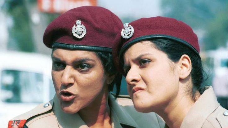 Goodness Gracious Me: Back Where They Came From - Picture shows Meera Syal and Nina Wadia as Delhi policewomen, Renu and Rita. Through a series of mishaps the Coopers leave England for a skiing holiday in Switzerland - only to somehow end up in India in BBC TWOs one off special, Goodness Gracious Me: Back Where They Came From. (l-r) Syal, Meera ; Wadia, Nina