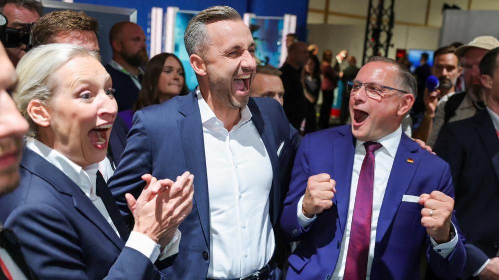 German far-right set for big win in eastern state – projections Top candidate of the far-right Alternative for Germany (AfD), Ulrich Siegmund, with party co leaders Alice Weidel and Tino Chrupalla, reacts after polls closed, on the day of the Saxony-Anhalt state elections