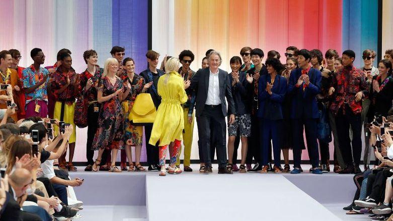 British designer Paul Smith (C) acknowledges the audience at the end of the Paul Smith Menswear Spring/Summer 2018 show as part of Paris Fashion Week on June 25, 2017 in Paris, France.