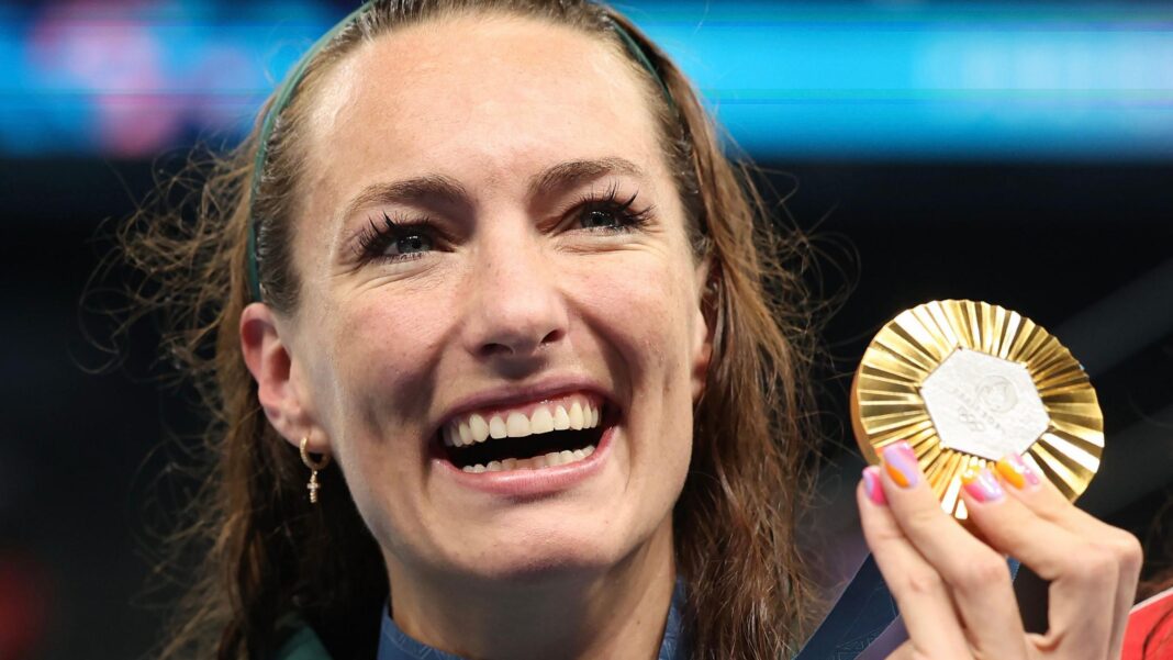 Yu, 13, completes hat-trick of golds at Asian Games A headshot show Tatjana Smith smiling broadly as she holds up her 100m breaststroke gold medal during the medal ceremony at the Paris 2024 Olympic Games