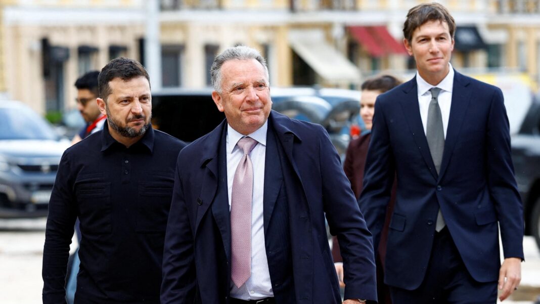 three men in suits walking outside.