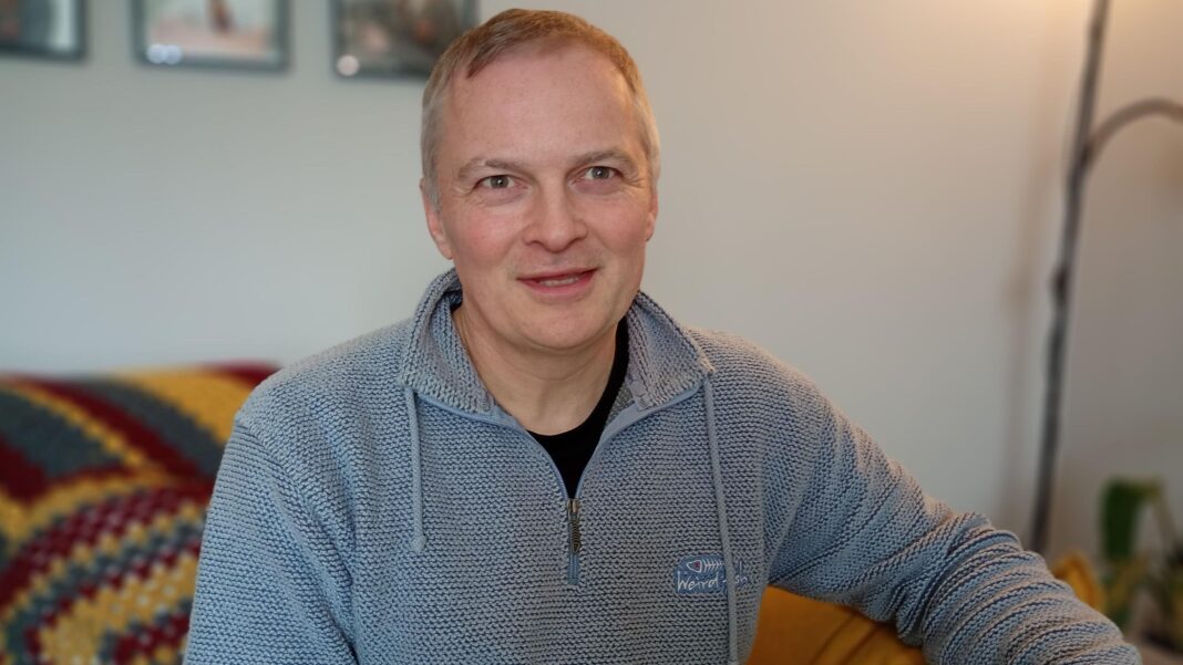 ‘My cancer spread while I waited months for surgery’: The cost of England’s cancer wait times A man with grey hair wearing a grey 1/4 zip