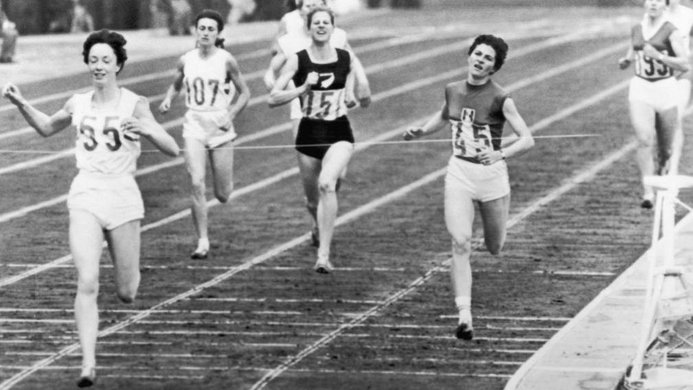 Ann Packer crosses the finish line of the women's 800m