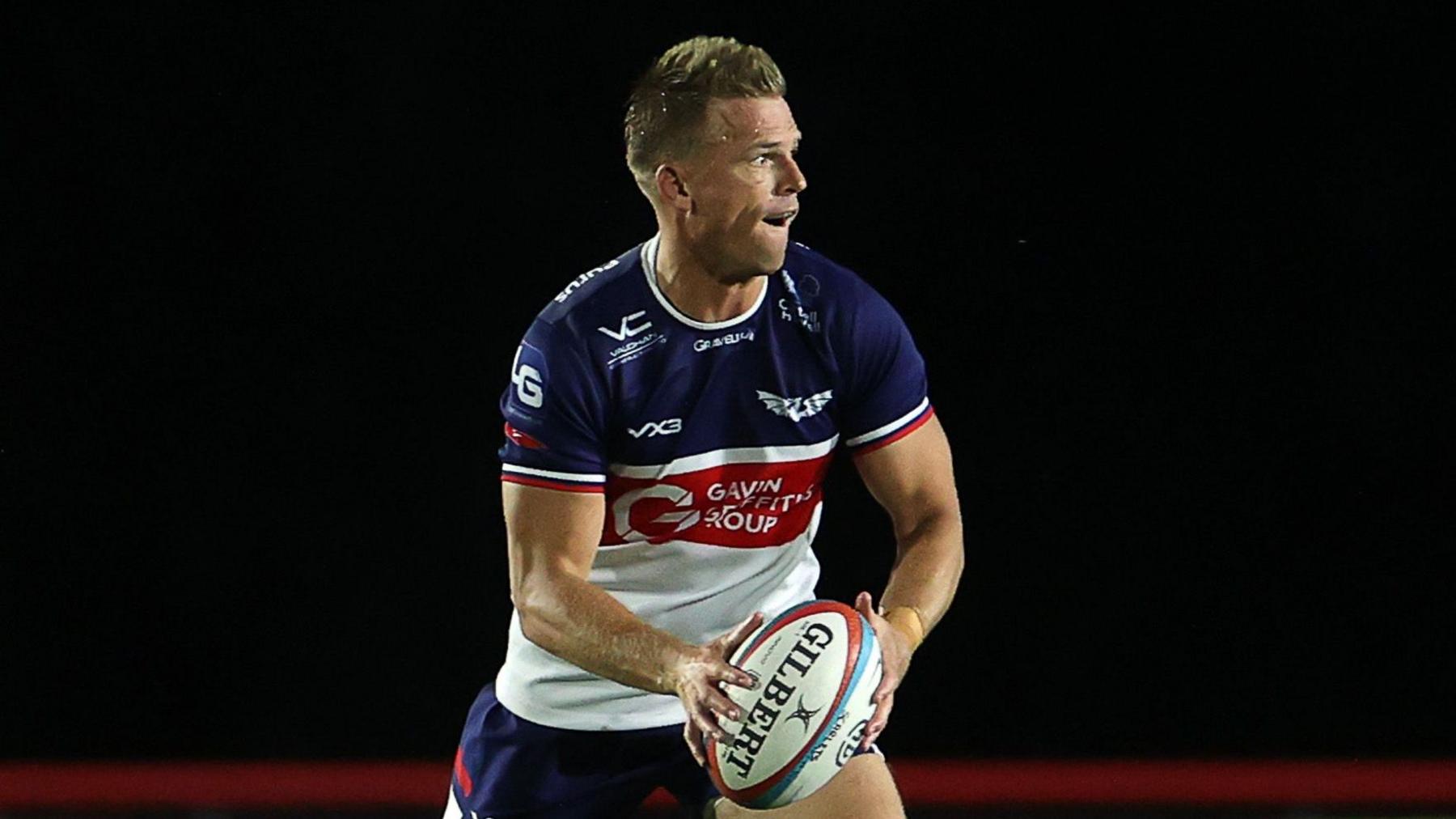 Gareth Anscombe prepares to pass the ball for Scarlets against Dragons in pre-season