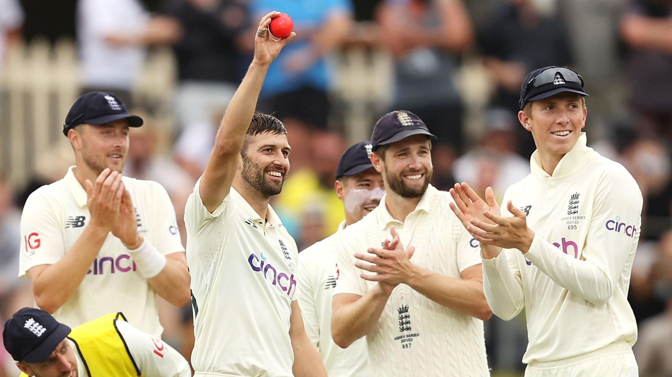 Mark Wood raises ball to crowd after six wickets in Hobart