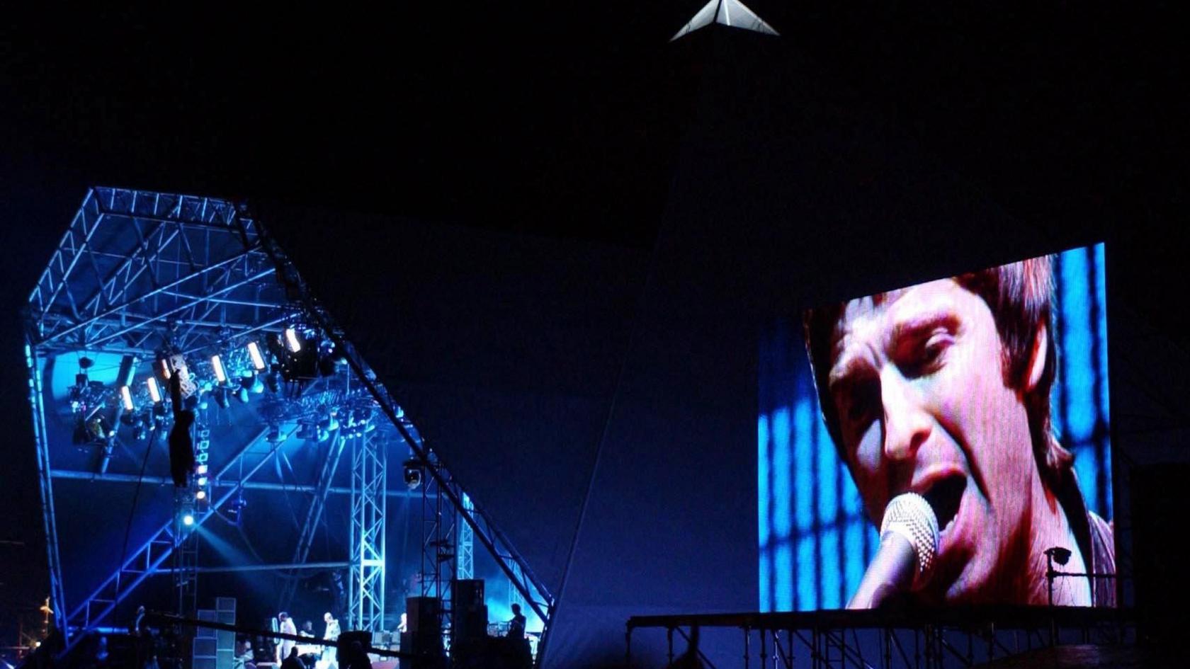 Oasis performing live on the Pyramid Stage at Glastonbury Festival 2004