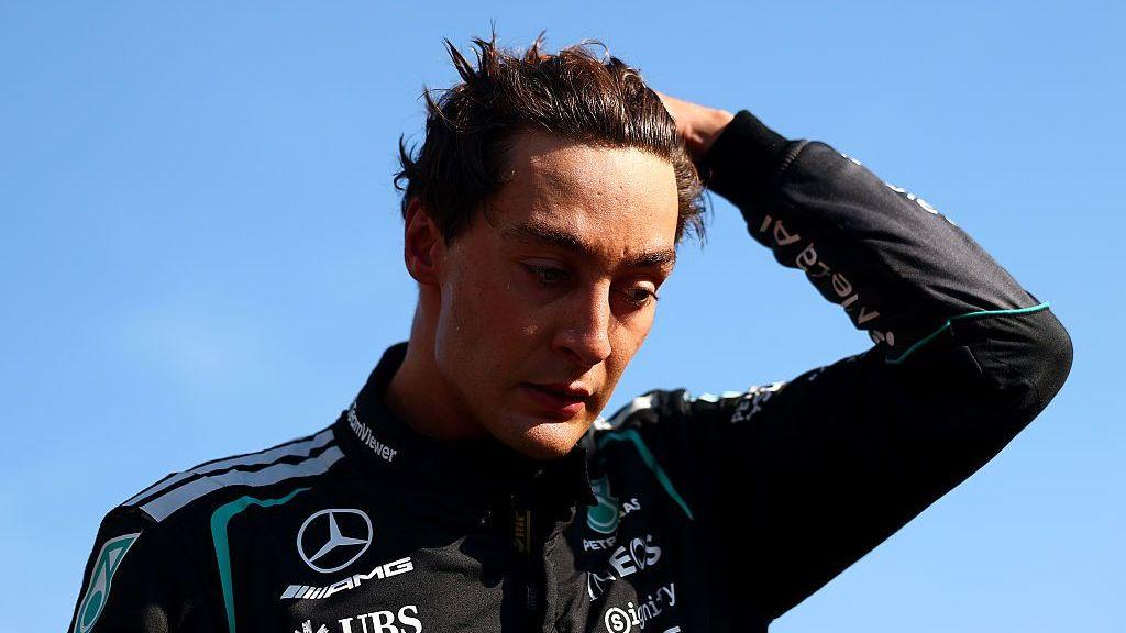 George Russell runs his left hand through his hair following the Italian Grand Prix