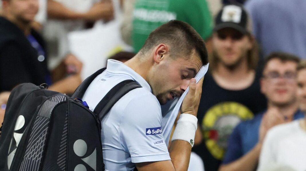 From match point to US Open exit – lucky loser denied history Arthur Gea wipes his face as he walks off court at the US Open