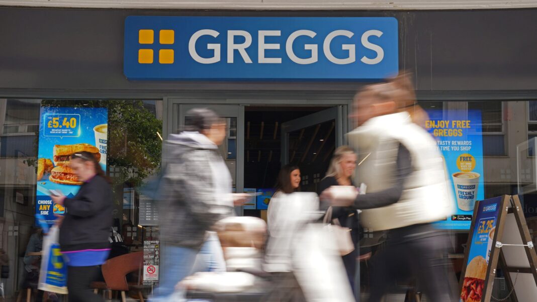 Greggs to shut four factories and cut 740 jobs A stock image of a Greggs shop. Blurred figures of shoppers are portrayed walking past the shop and coming out of the store's door. There are adverts for their products on the windows.