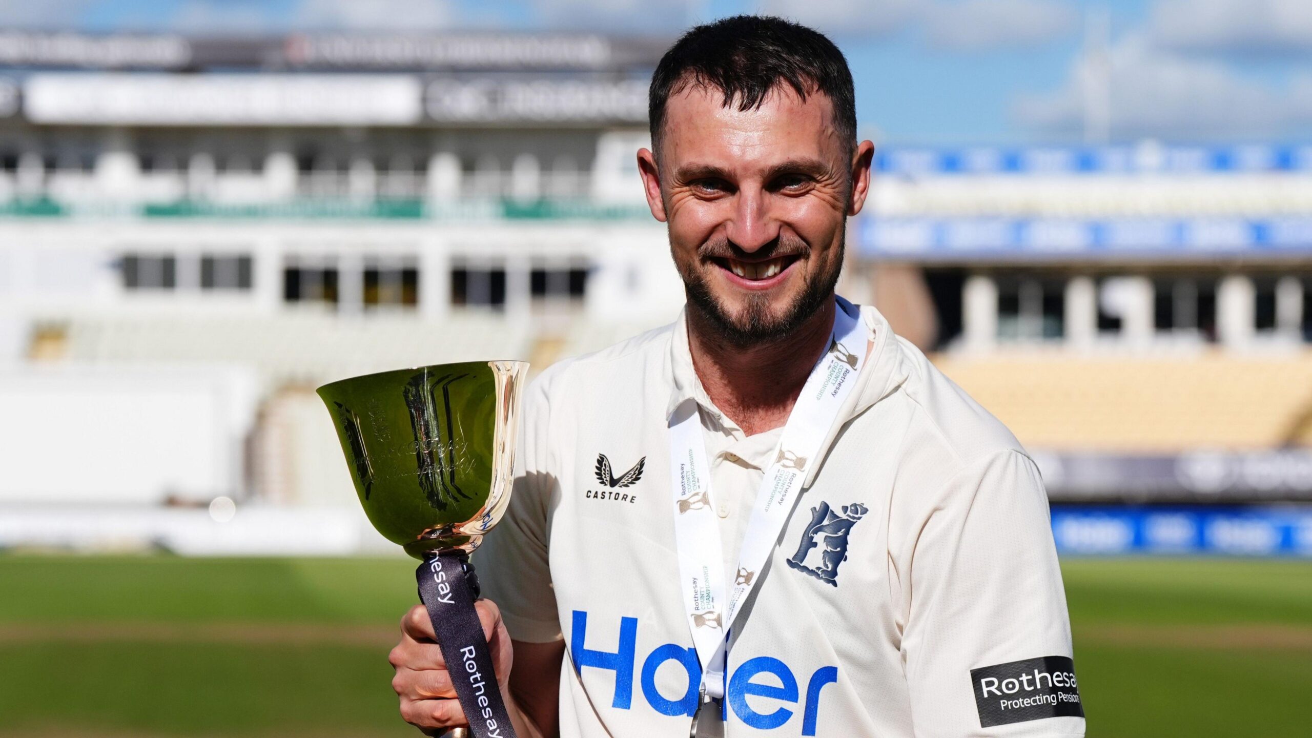 Ed Barnard holds the County Championship trophy