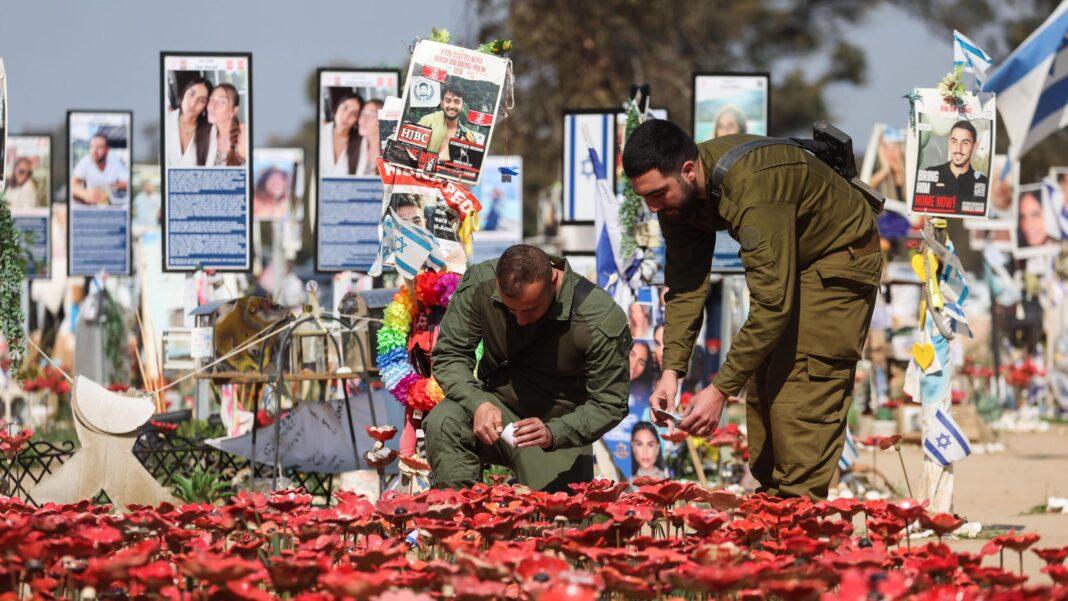 Israel’s Netanyahu to sue newspaper over claim UAE warned him of 7 October attack Israeli soldiers light candles at a memorial site for the victims of the Hamas attack at the Supernova music festival on 7 October 2023, near Kibbutz Reim, southern Israel (31 January 2025)