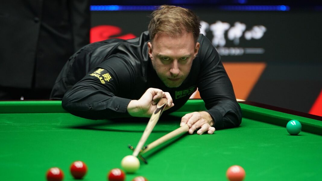 Trump thrashes Zhao to reach last four of British Open Judd Trump plays a shot with the rest