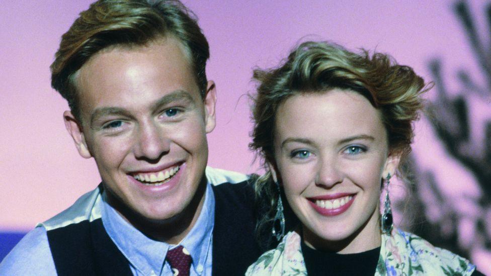 Jason Donovan and Kylie Minogue pose for Red Nose Day 1989 in the studio on 10 March in London.