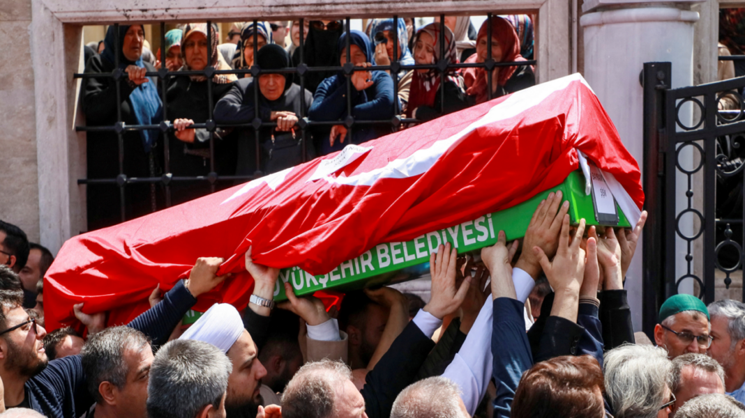People carry the coffin of a victim of a school shooting during the funeral prayers at a mosque in Kahramanmaras, Turkey