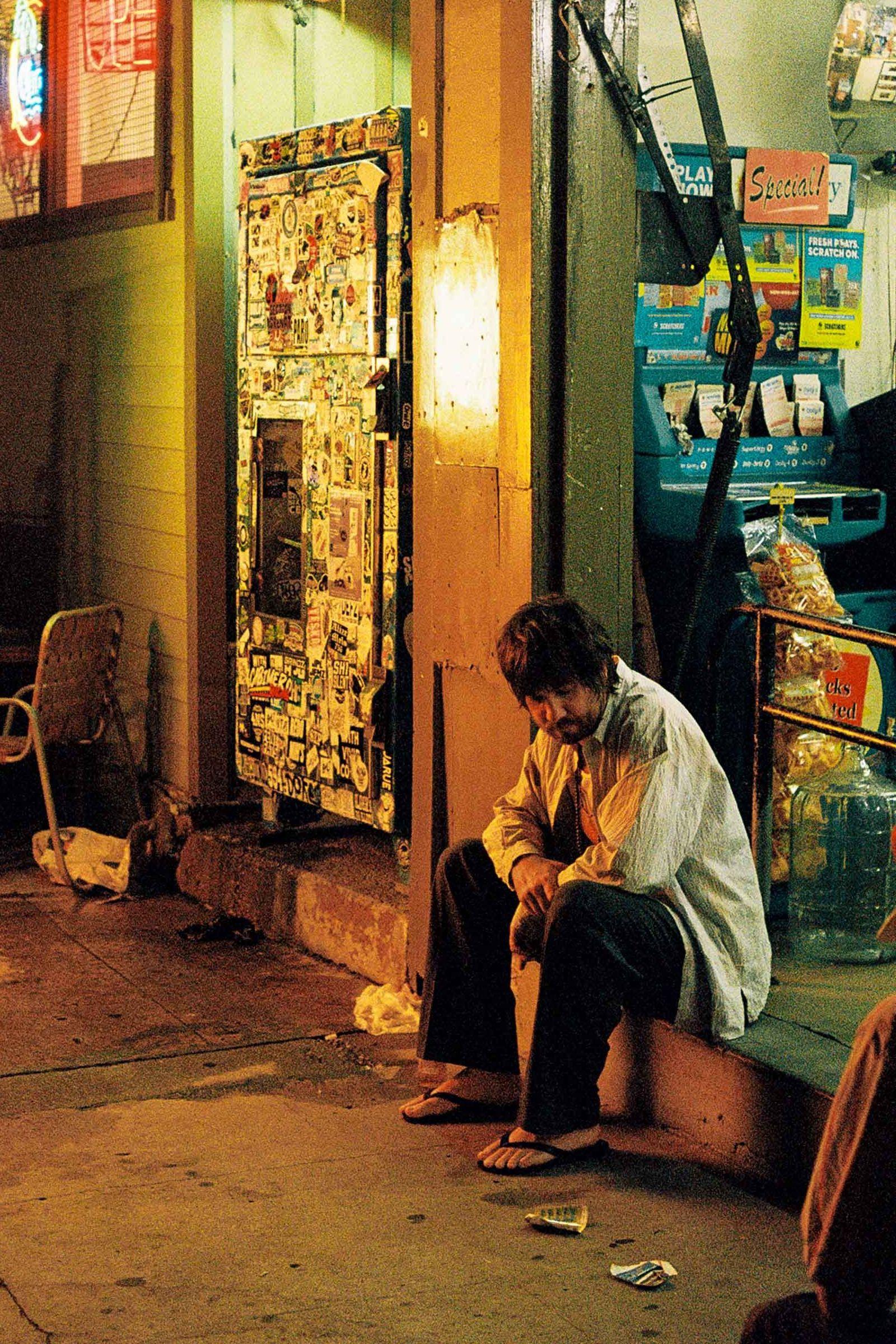 Kevin Parker of Tame Impala has a moment of solitude on the low-lit set of the music video for his track Loser