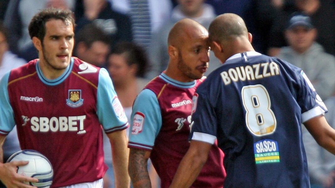 Two players put their heads against each other