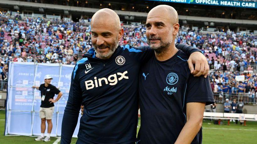 A smiling Enzo Maresca and Pep Guardiola chat after a pre-season friendly between Chelsea and Manchester City in the USA in 2024