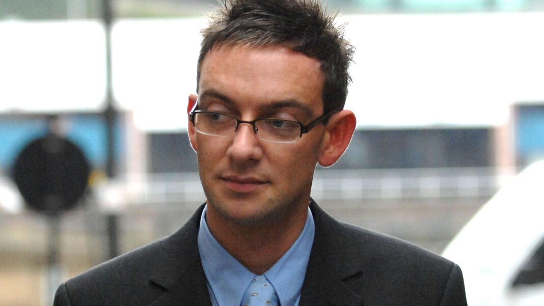 Murder or medical mix-up? New questions in the case of killer nurse Colin Norris Colin Norris - Portrait photograph of a person wearing glasses, a dark suit jacket and a light blue shirt and tie, standing indoors with a blurred background.