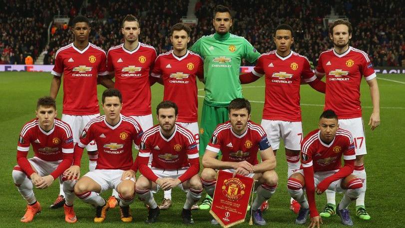 Manchester United's players line up before a Europa League last-32 tie against Midtjylland at Old Trafford in 2016