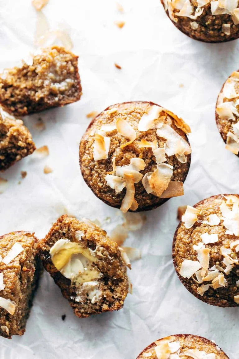 Apple muffins topped with coconut.