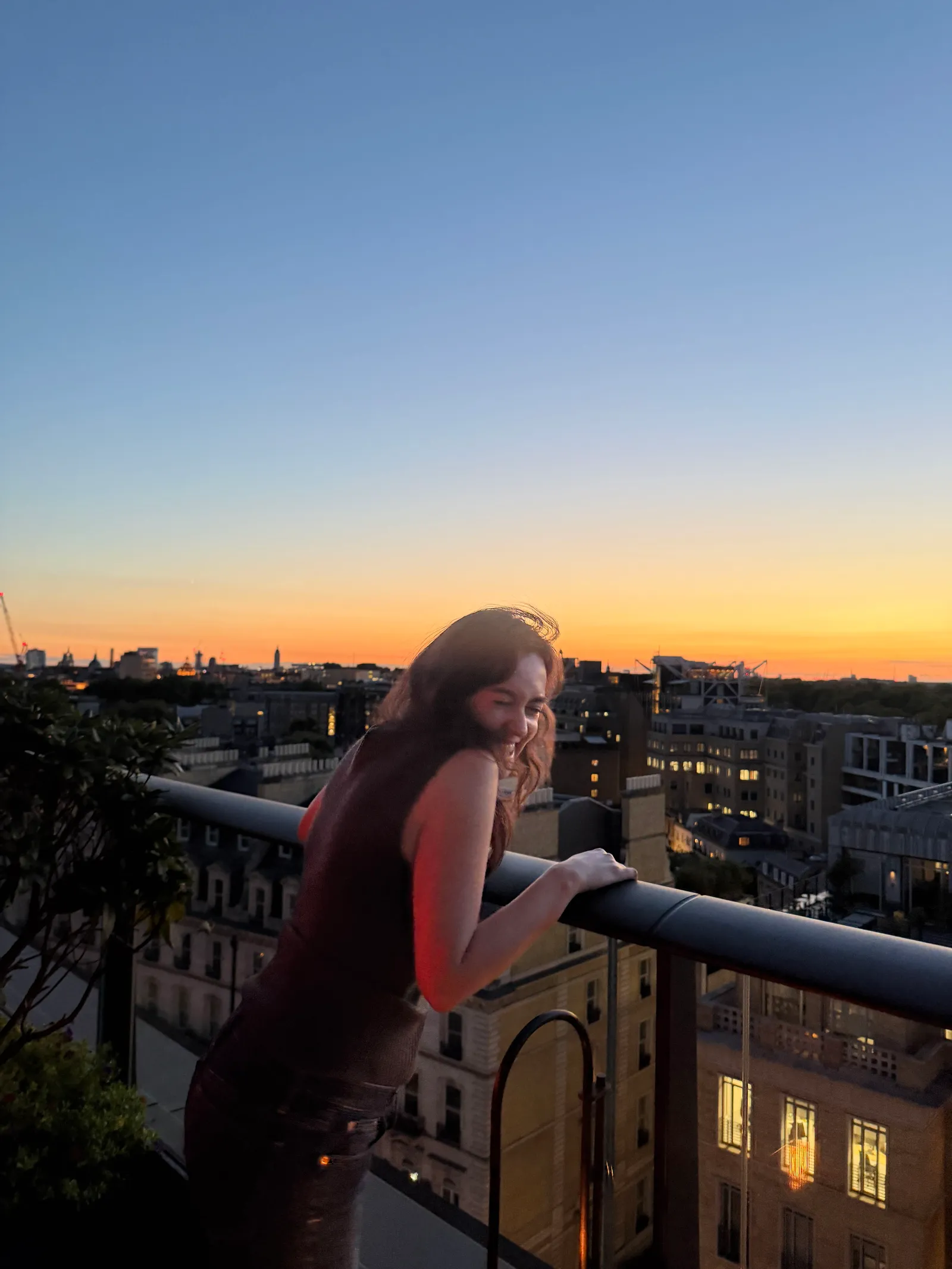 Image may contain Architecture Balcony Building Urban Cityscape Nature Outdoors Sky Adult Person City and Head