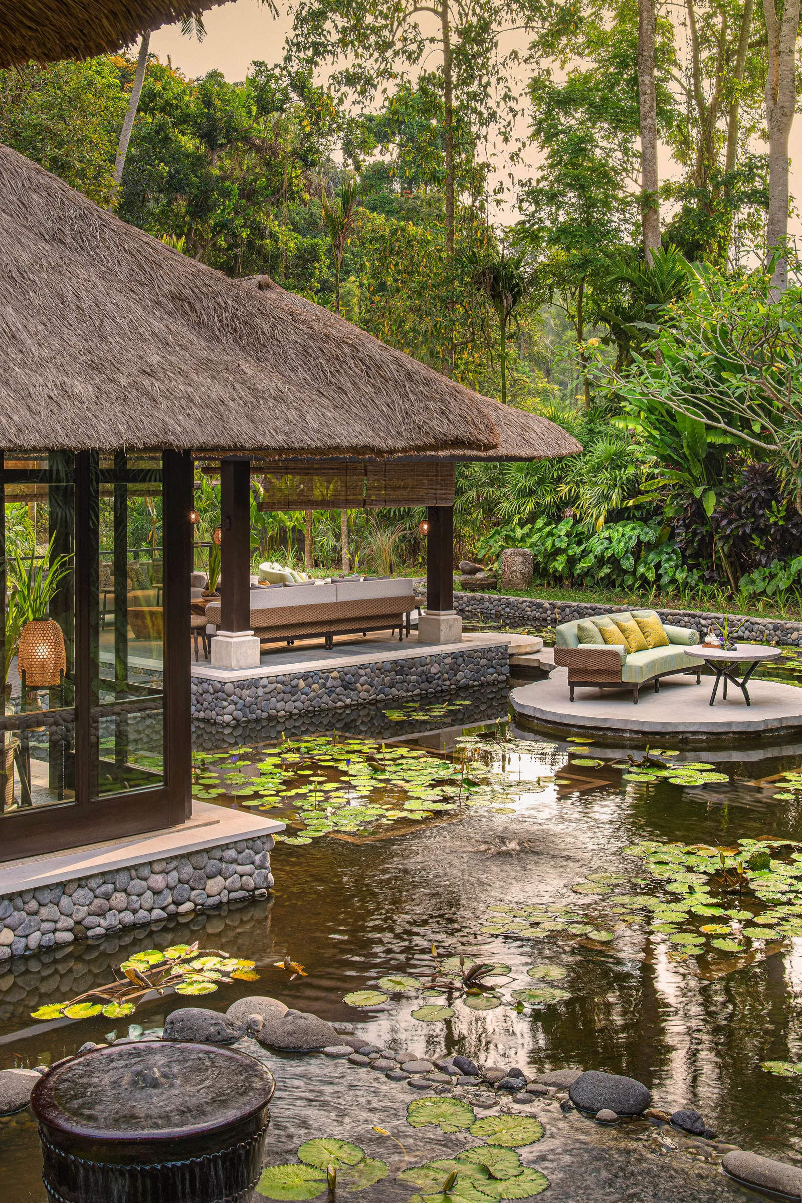 Image may contain Architecture Building Hotel Resort Nature Outdoors Pond Water Scenery Land Plant and Rainforest