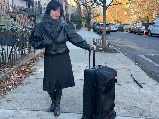 Image may contain: Alice Sara Ott, Adult, Person, Baggage, Clothing, and Coat