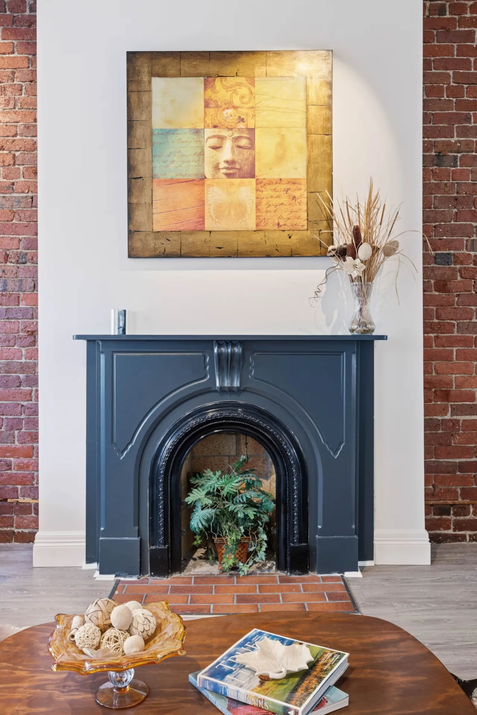Image may contain Fireplace Indoors Interior Design Adult Person and Plant