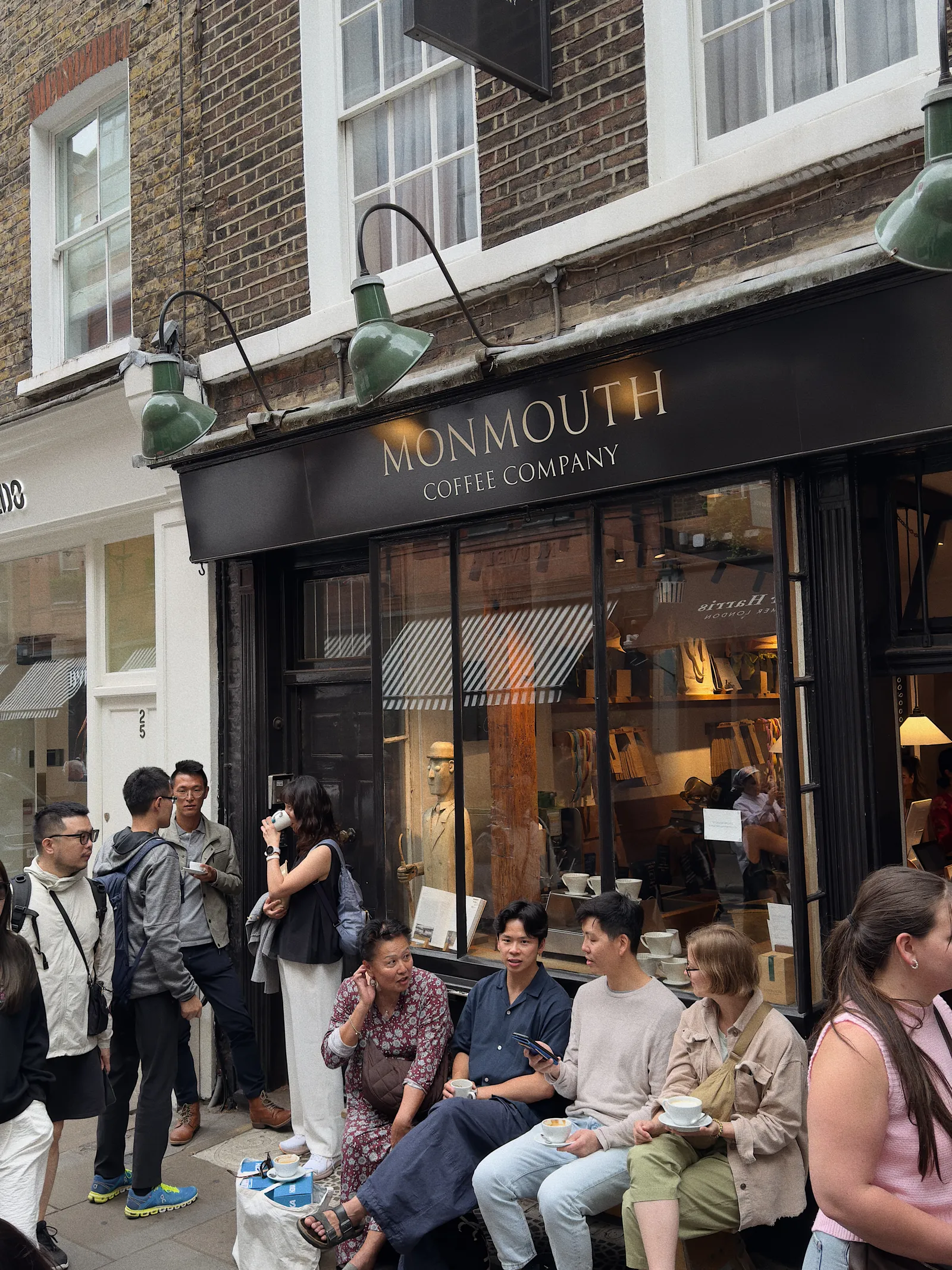 Image may contain Min Xiaofen Mark Lui Chi Muoi Lo Kenji Gotō Cafe Indoors Restaurant Urban Accessories and Bag