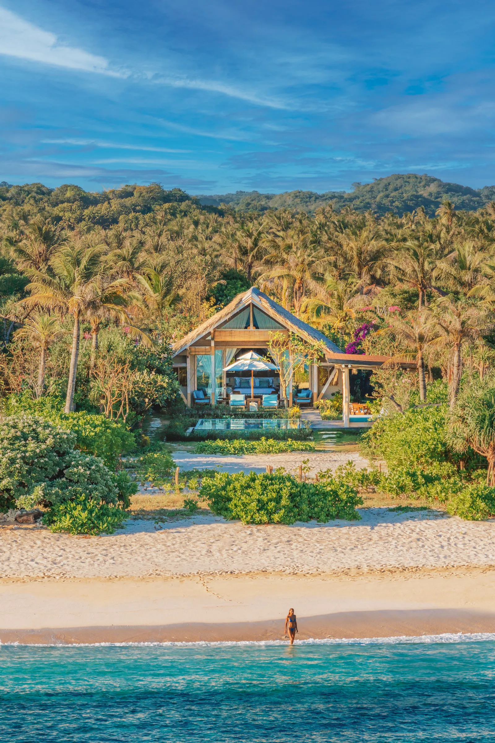 Image may contain Summer Plant Vegetation Outdoors Architecture Building Hotel Resort Nature Sea and Water