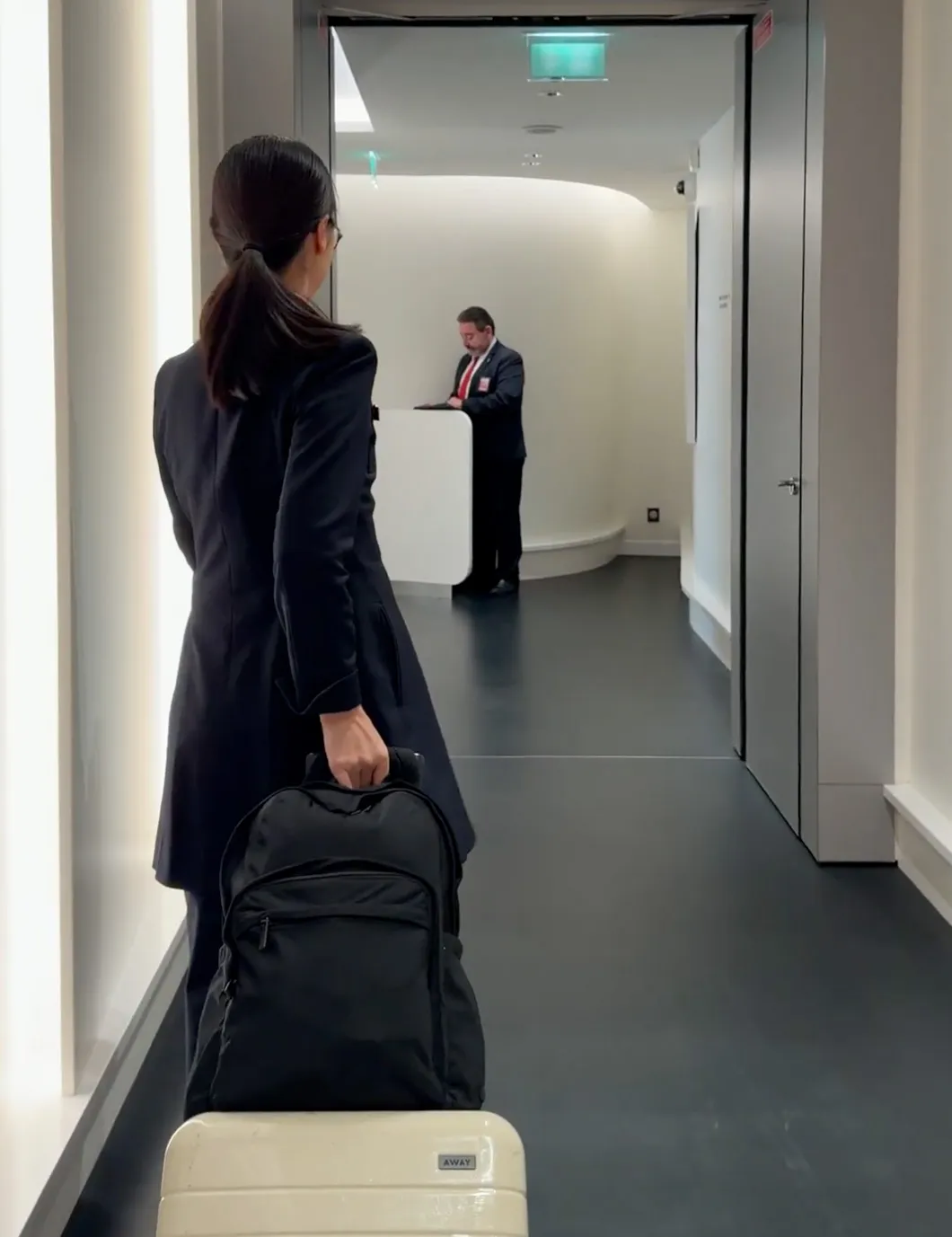Image may contain Adult Person Baggage Clothing and Coat
