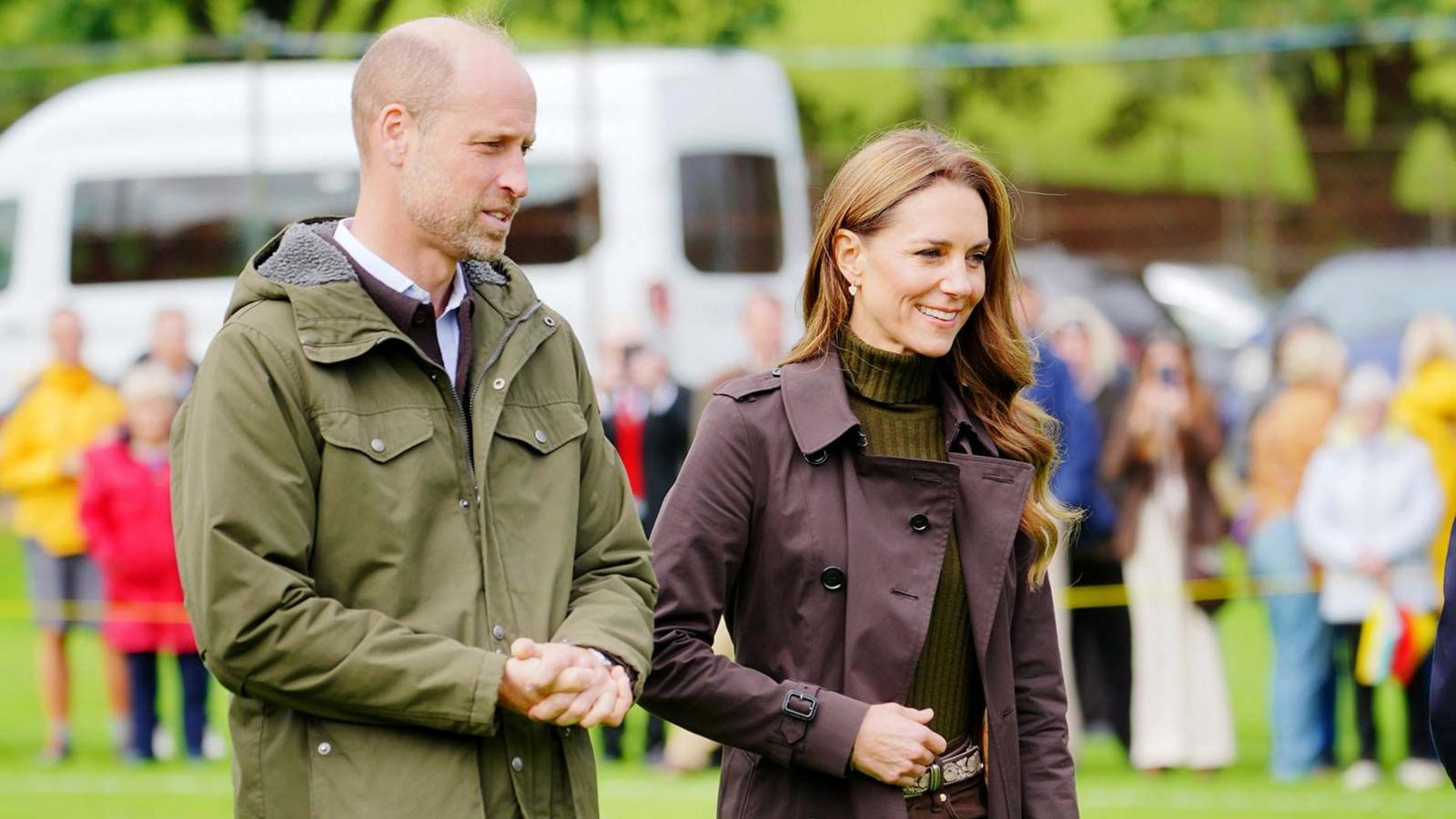 Catherine and William smile as they visit Bute