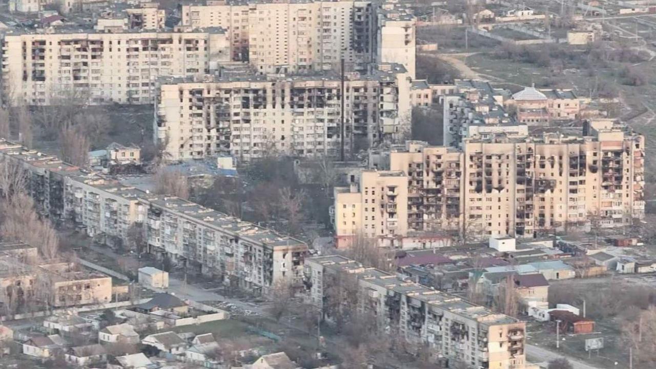A cityscape showing ruined buildings in a war in Ukraine