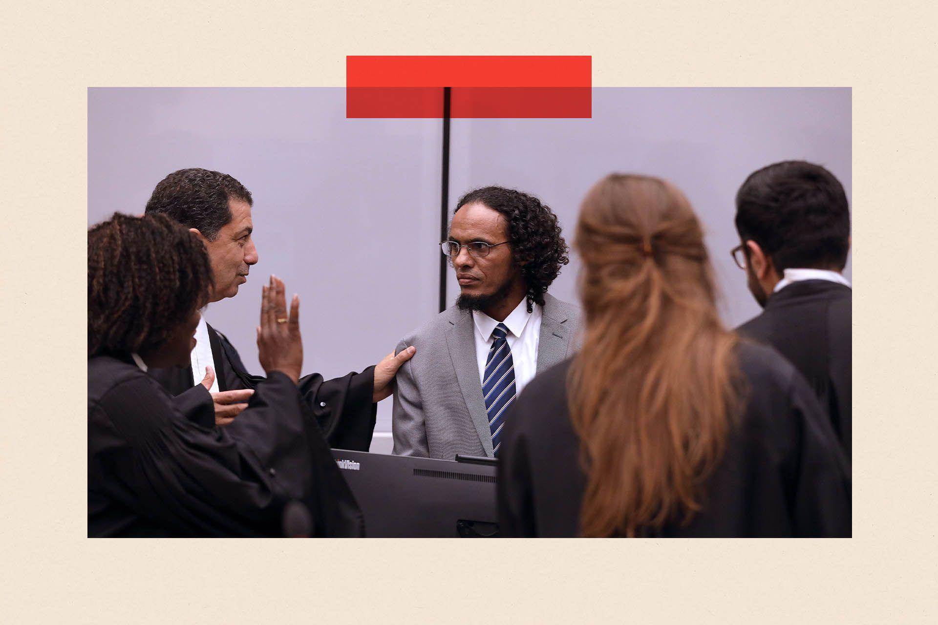 Malian jihadist Ahmed al-Faqi al-Mahdi speaks with his lawyer at the International Criminal Court (ICC) in The Hague