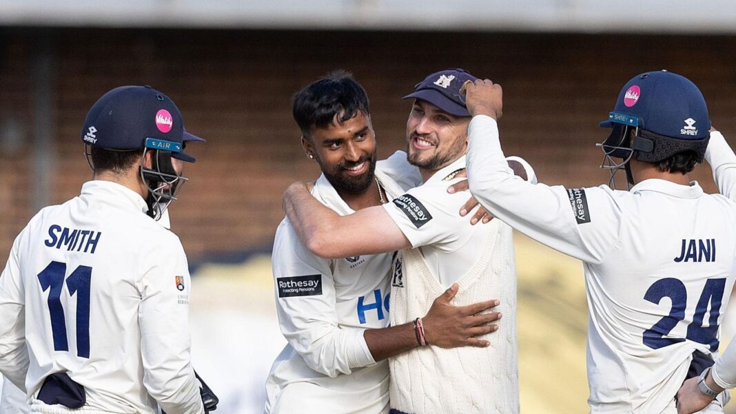 Warwickshire celebrate taking a wicket